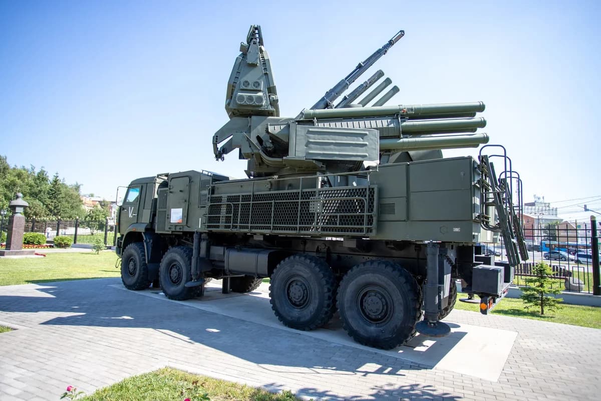 A military missile defense system mounted on a truck displayed outdoors.