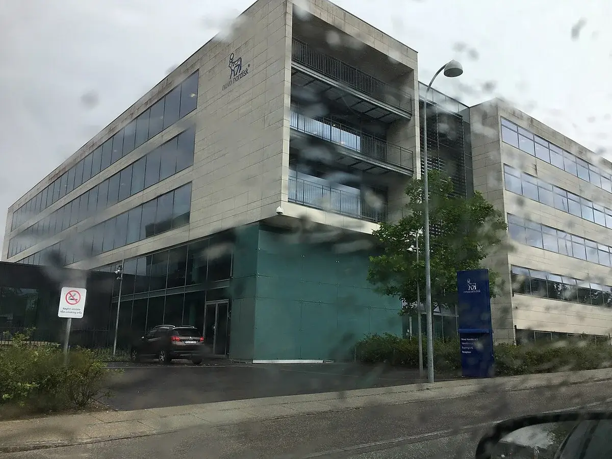 Novo Nordisk office building seen through rain on a window.
