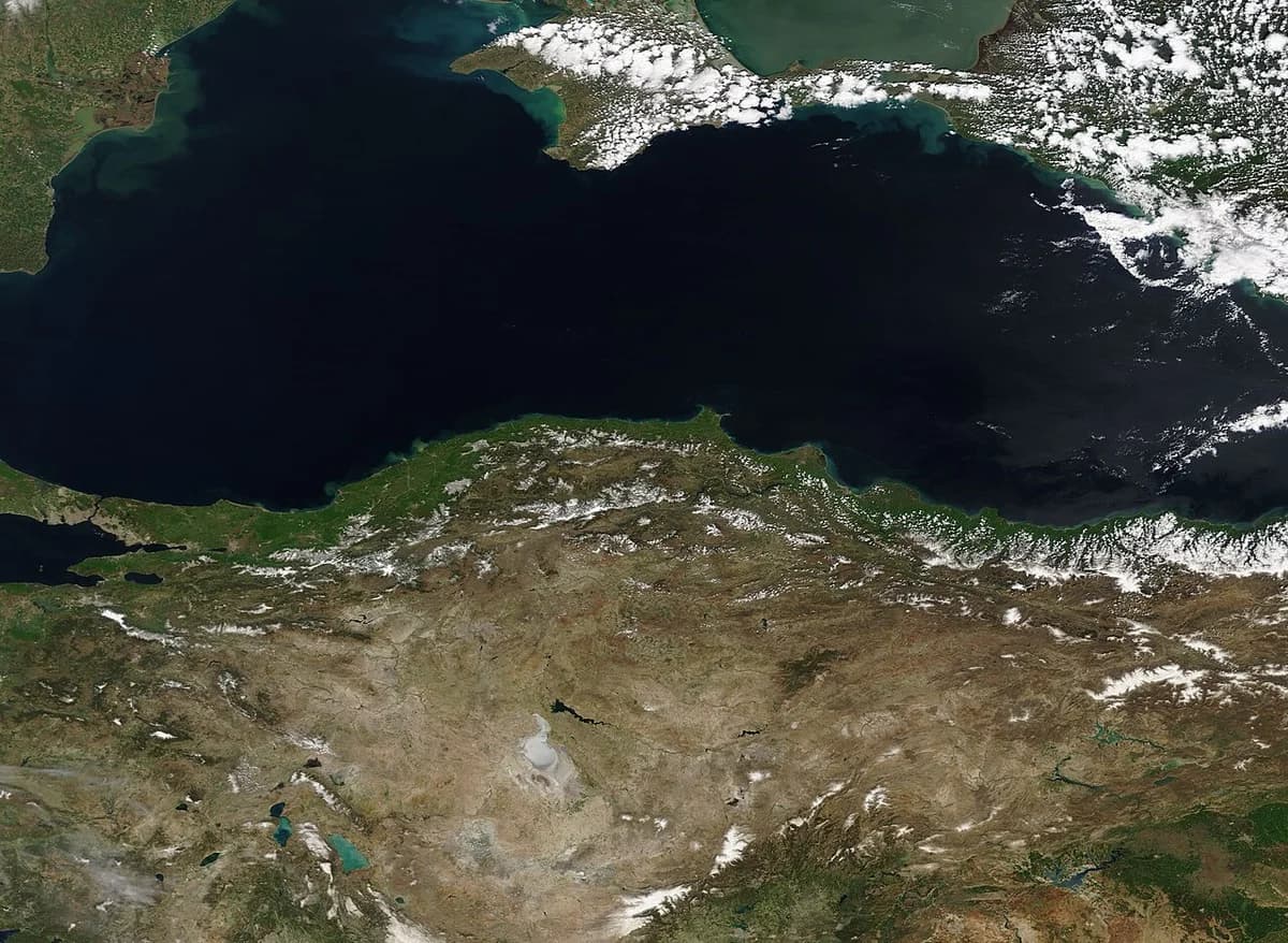 Satellite view of the Black Sea and northern Turkey with clouds.