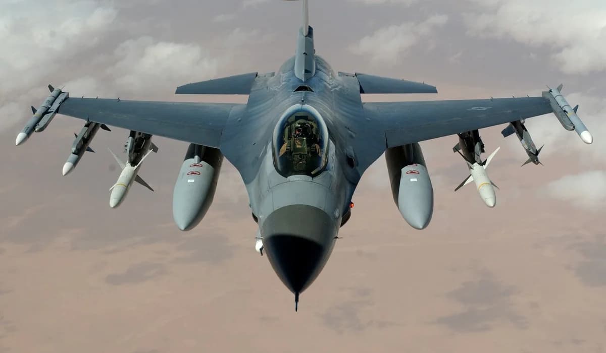fighter jet with missiles flying above desert