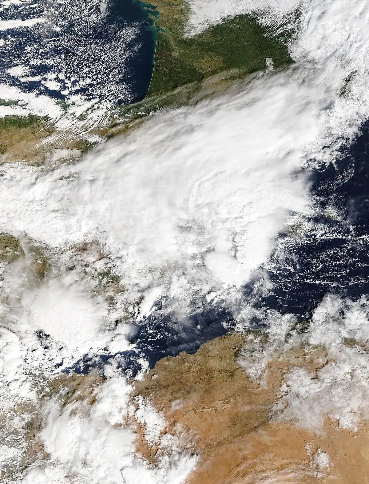 Satellite view of a large storm system over southeastern Spain and the western Mediterranean.