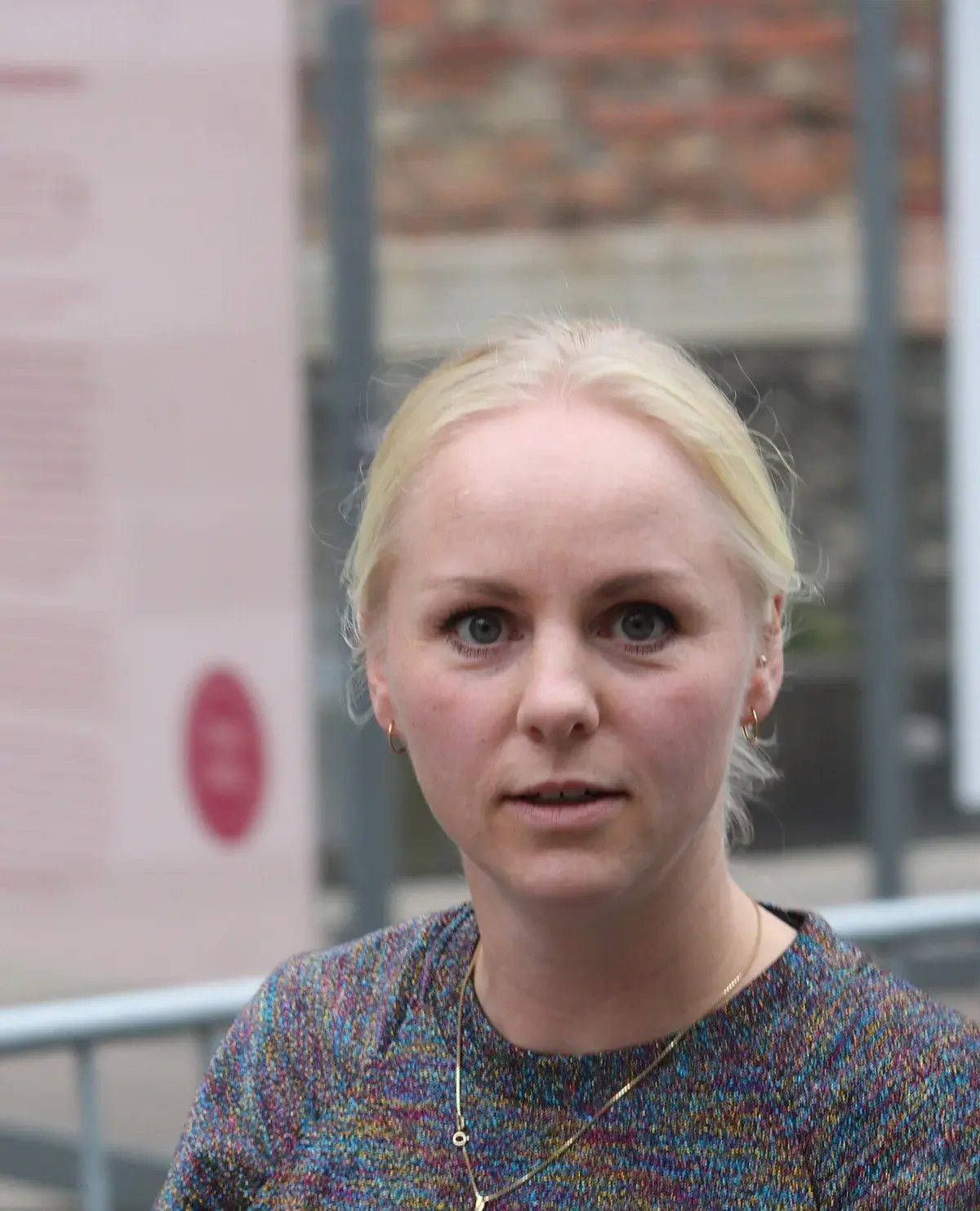 Close-up of Signe Munk standing outdoors at Christiansborg.