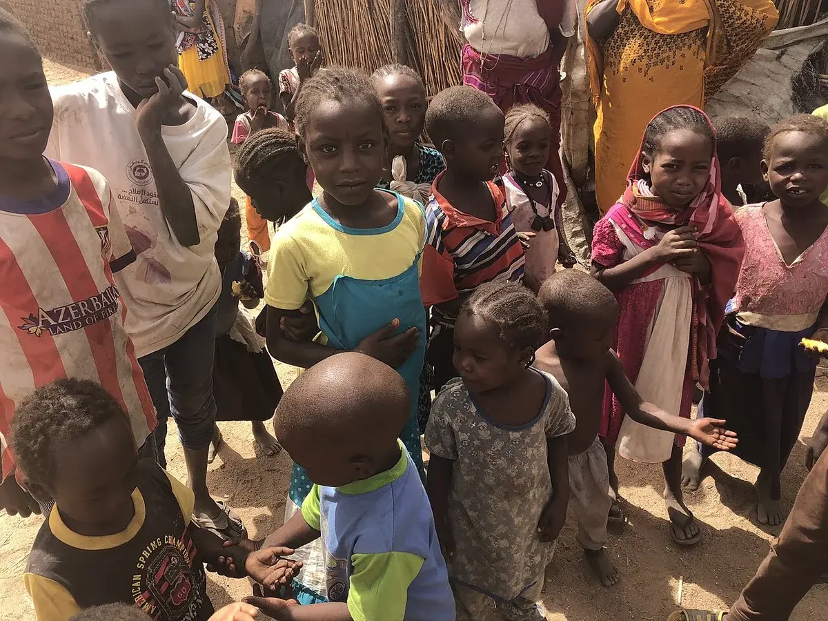 Children standing together in a displacement camp in Darfur, Sudan.