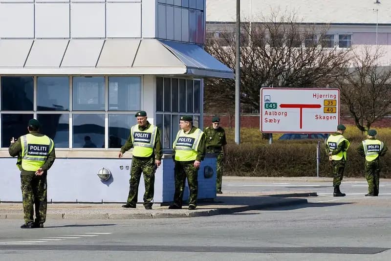 Danish police and home guard personnel on street corner